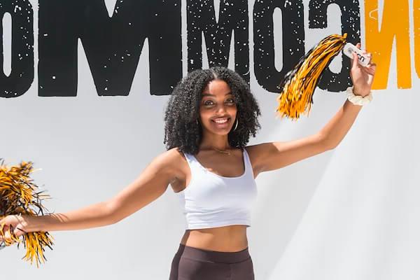 VCU student with pom-poms